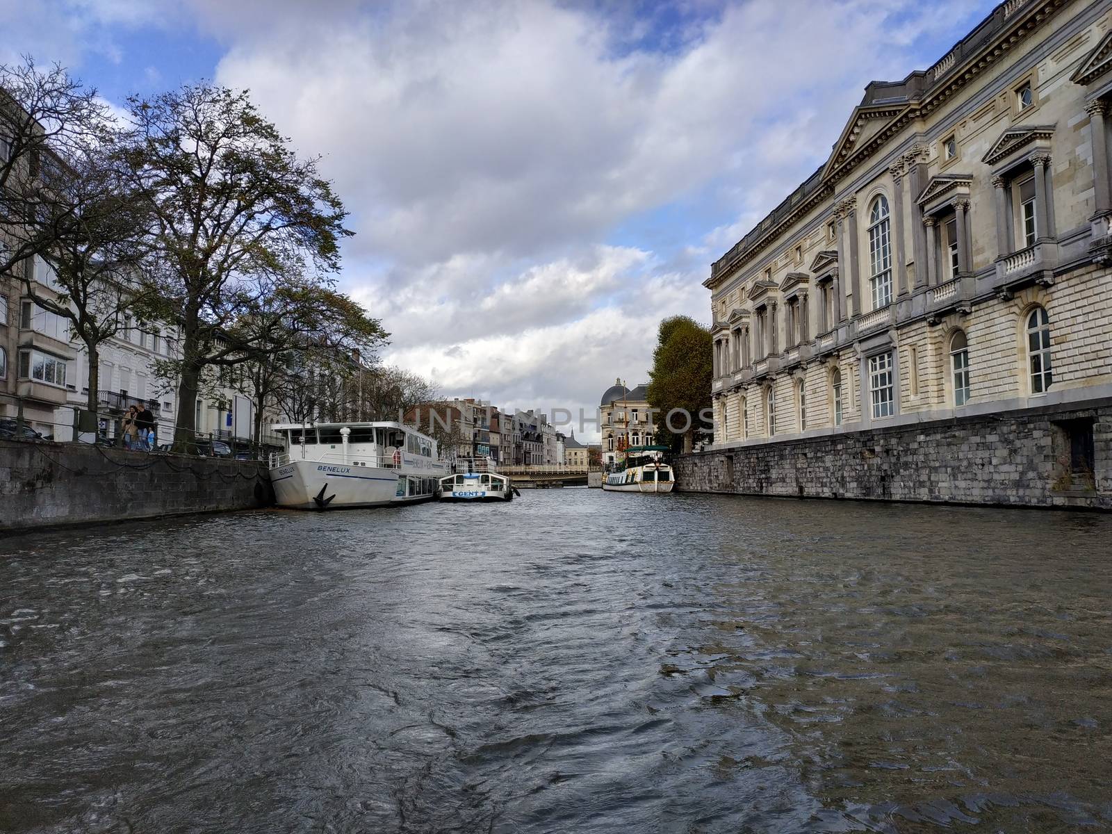 Ghent, Belgium - November 02, 2019: view on the streets and roads with tourists walking around by VIIIPhoto