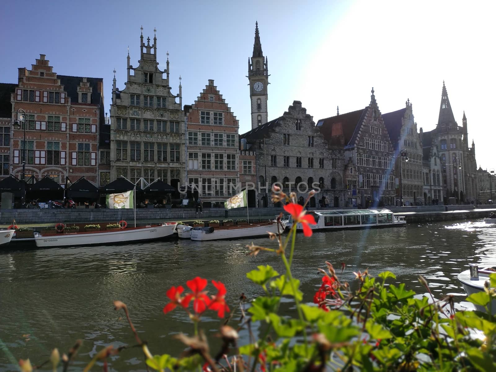 Ghent, Belgium - November 02, 2019: view on the streets and roads with tourists walking around by VIIIPhoto