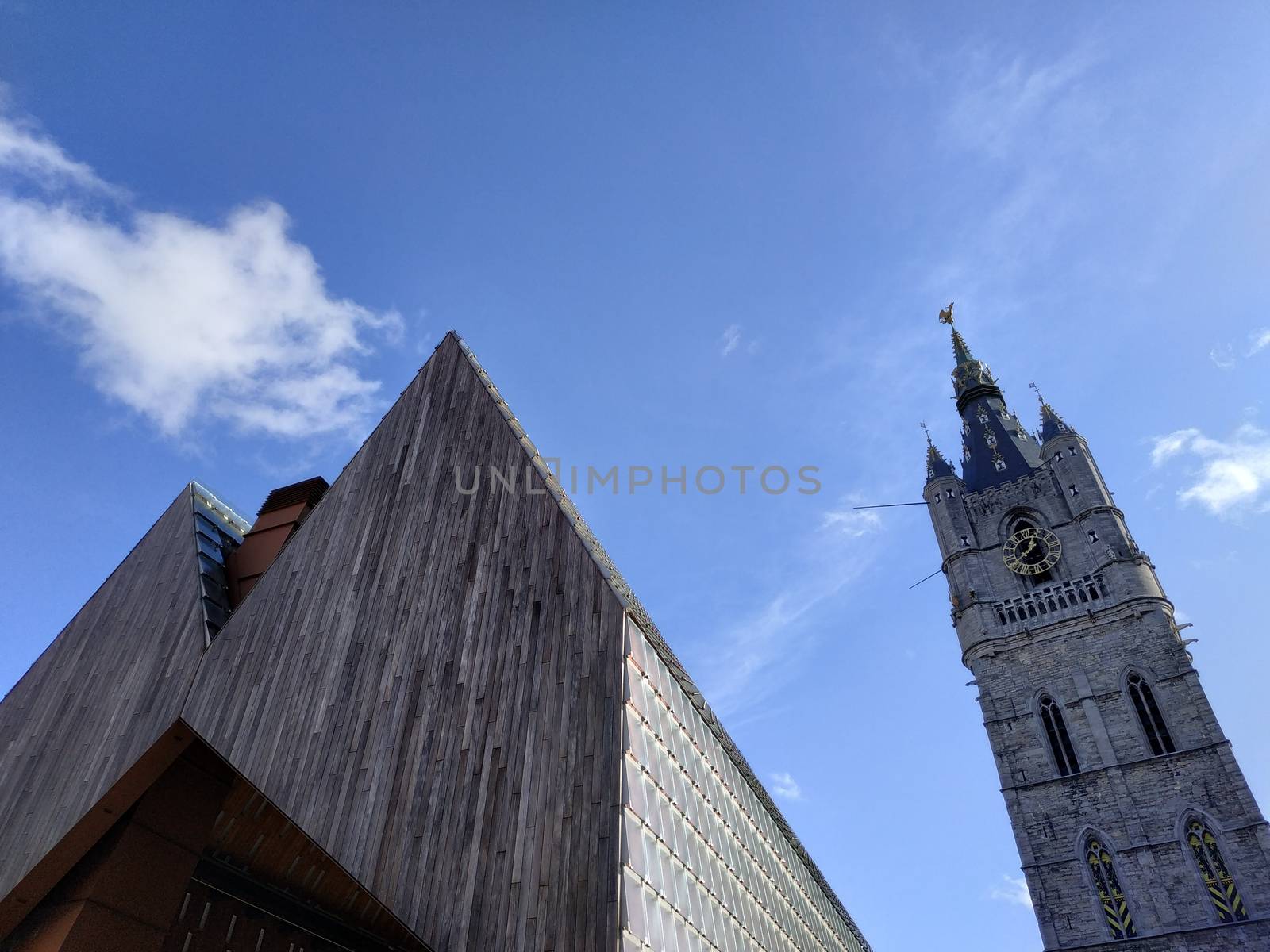 Ghent, Belgium casual view on the buildings streets and roads with tourists walking around by VIIIPhoto