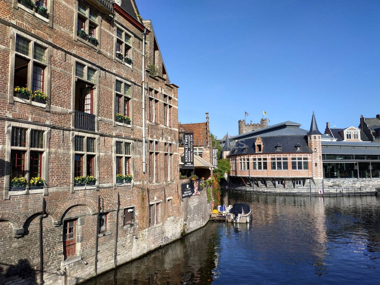 Ghent, Belgium - November 02, 2019: view on the streets and roads with tourists walking around by VIIIPhoto