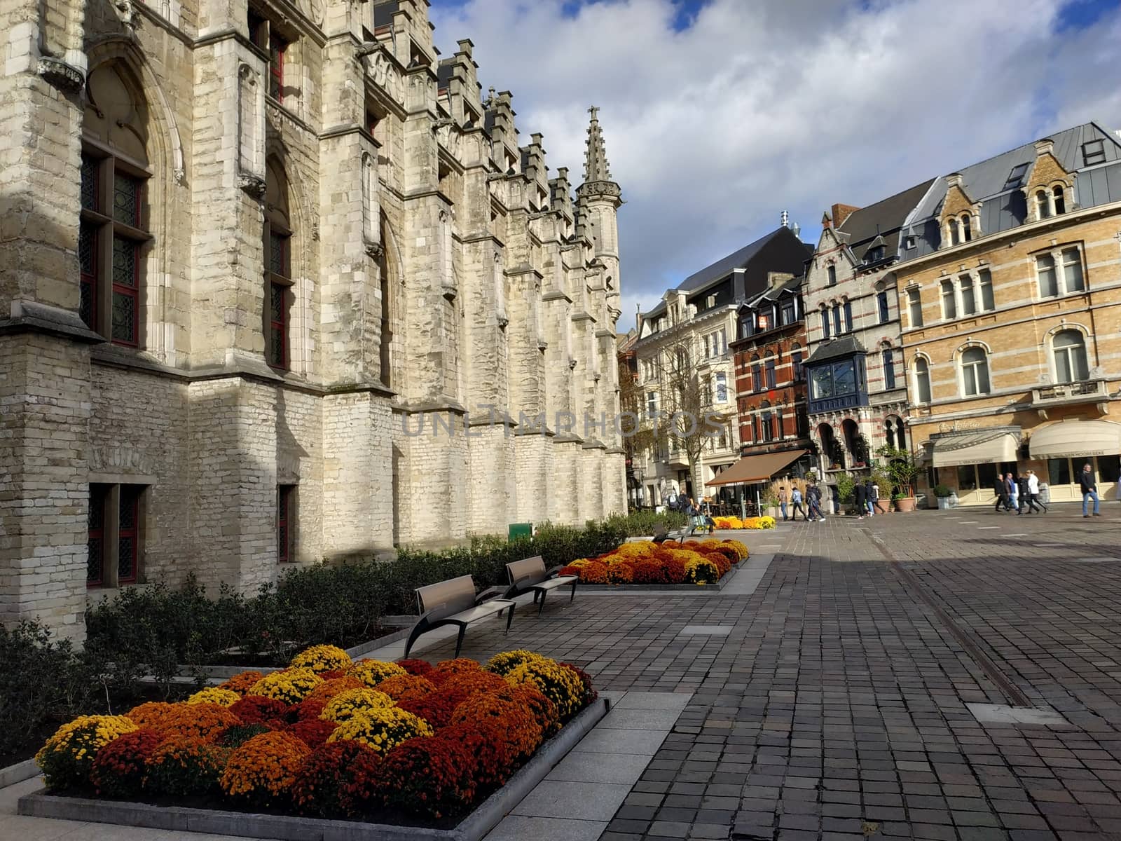 Ghent, Belgium - November 02, 2019: view on the streets and roads with tourists walking around by VIIIPhoto