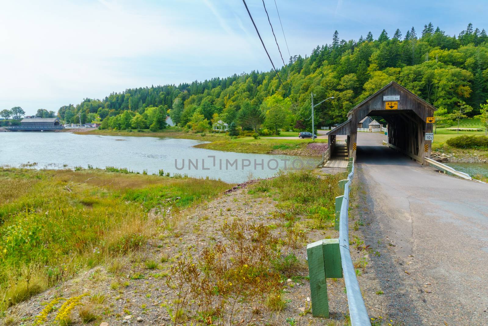 View of the two covered bridges at high tide, in St. Martins, New Brunswick, Canada