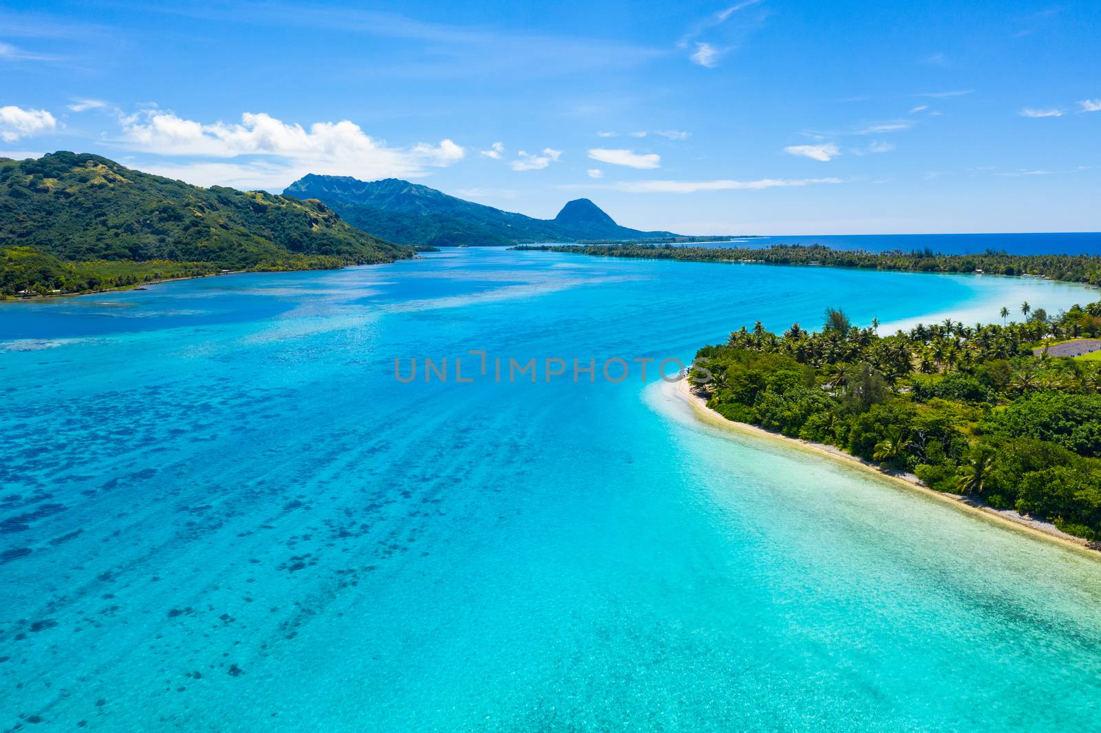 Aerial view of French Polynesia Tahiti island Huahine and Motu coral reef lagoon by Maridav