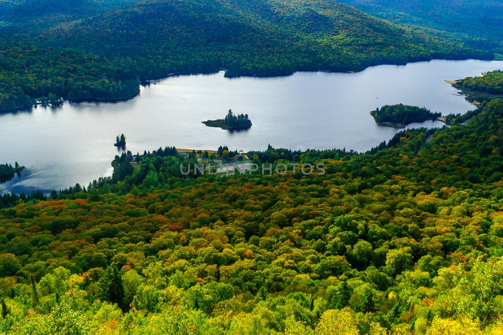 View of La Roche observation point, Monroe Lake and the park, with fall foliage colors in Mont Tremblant National Park, Quebec, Canada