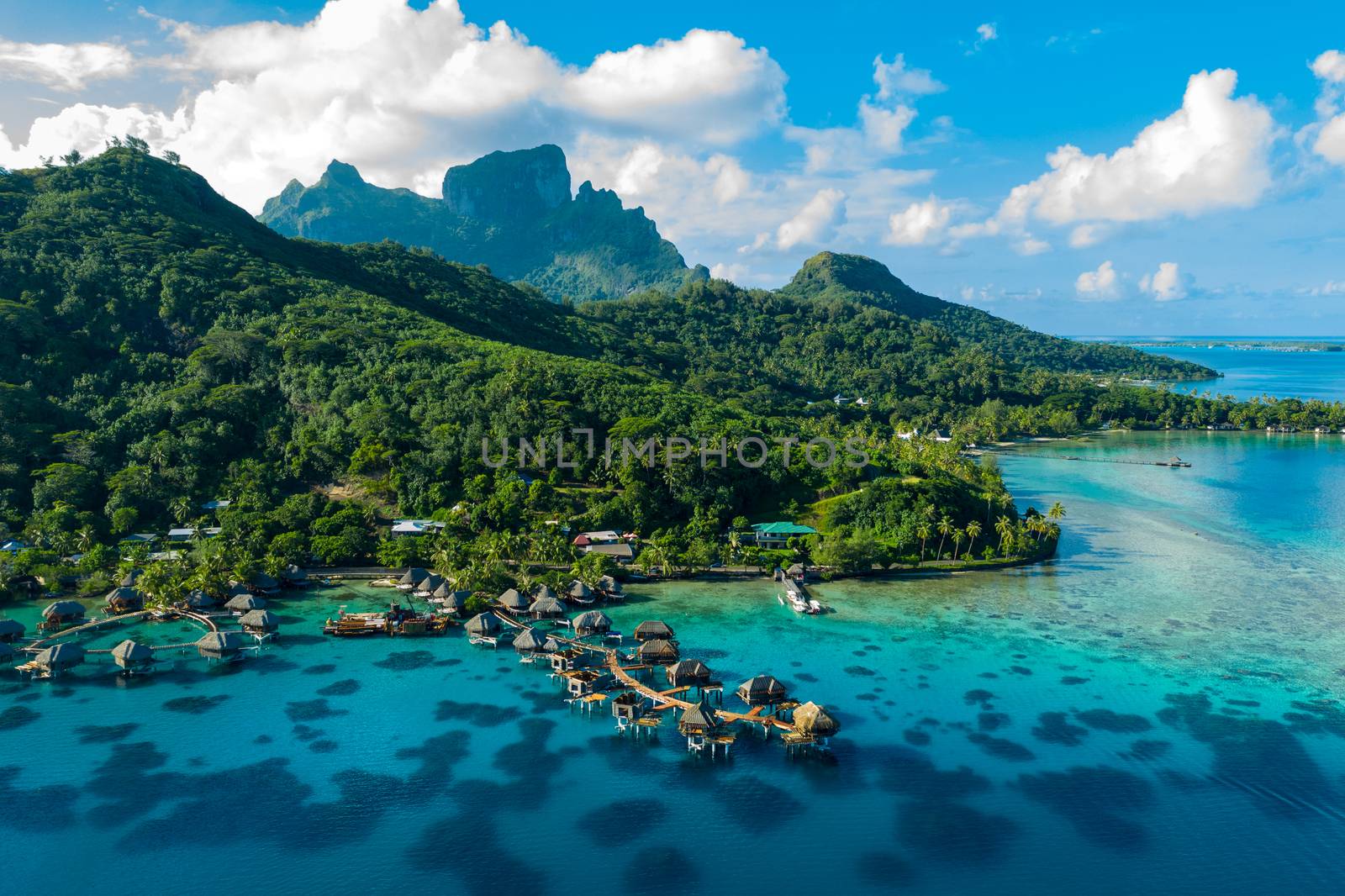 Bora Bora aerial drone image of travel vacation paradise and overwater bungalows by Maridav