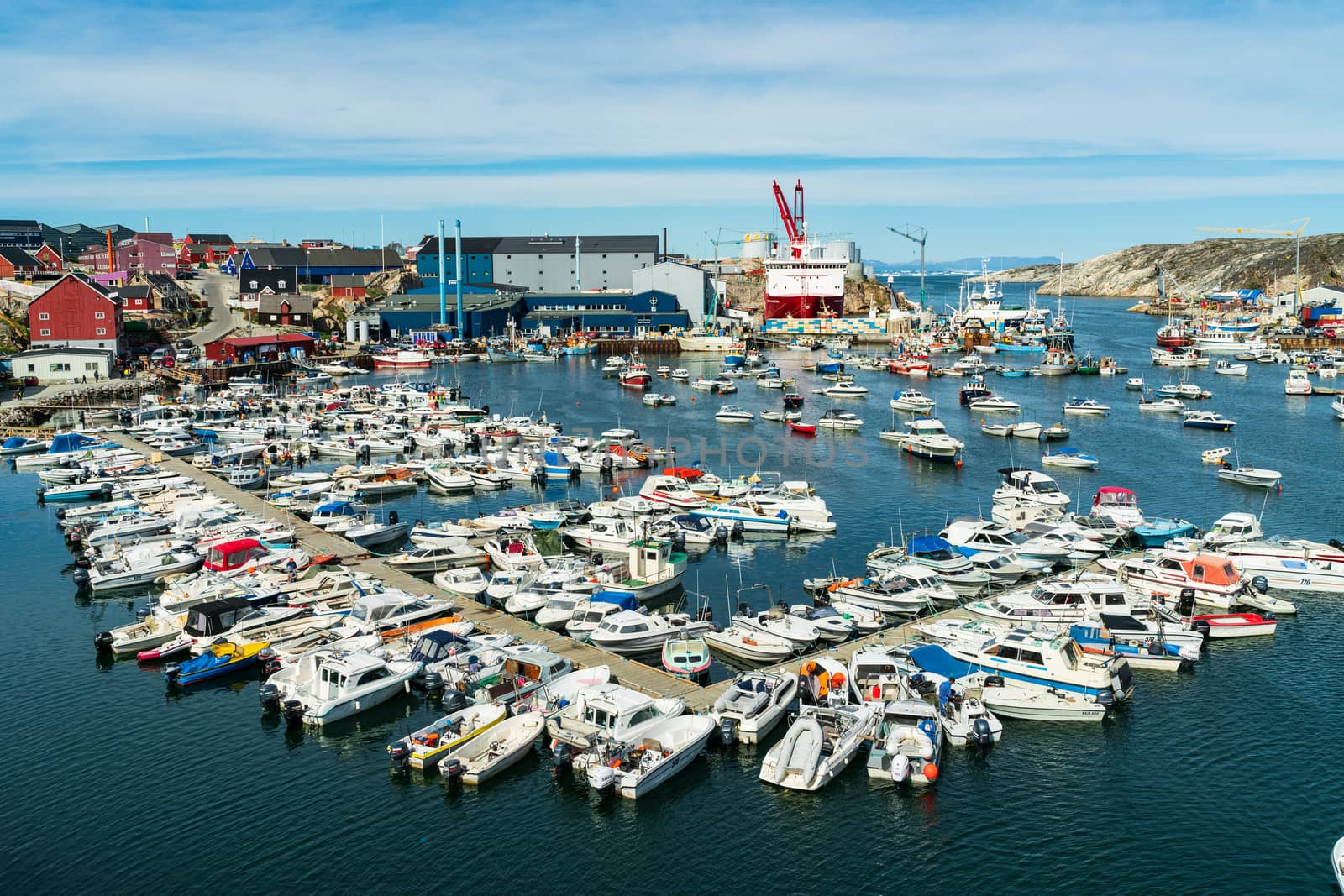 Ilulissat cruise ship harbor and boat harbour on famous Greenland tourist destination.