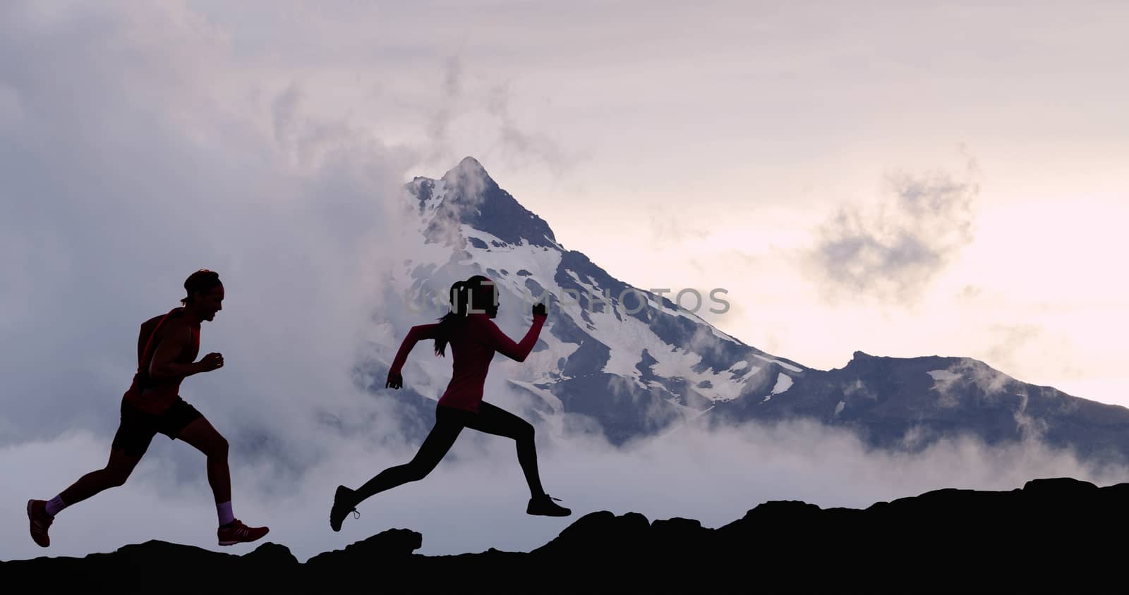 Running people athletes silhouette trail running in mountain summit background by Maridav