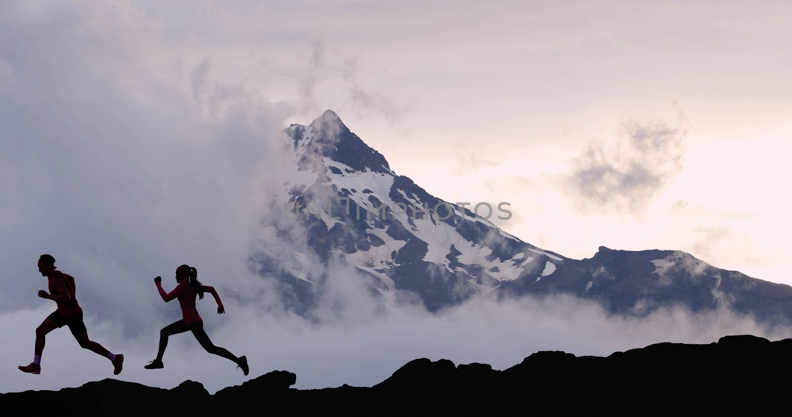 Running people athletes silhouette trail running in mountain summit background by Maridav