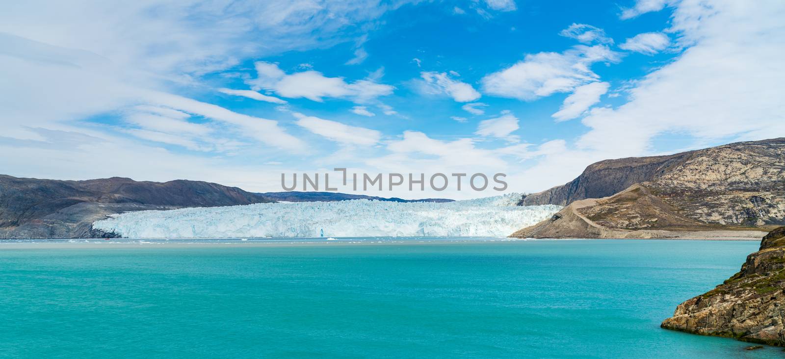 Global Warming and Climate Change . Greenland Glacier front of Eqi glacier in West Greenland AKA Ilulissat and Jakobshavn Glacier. Drains 6.5 percent of the Greenland ice sheet.