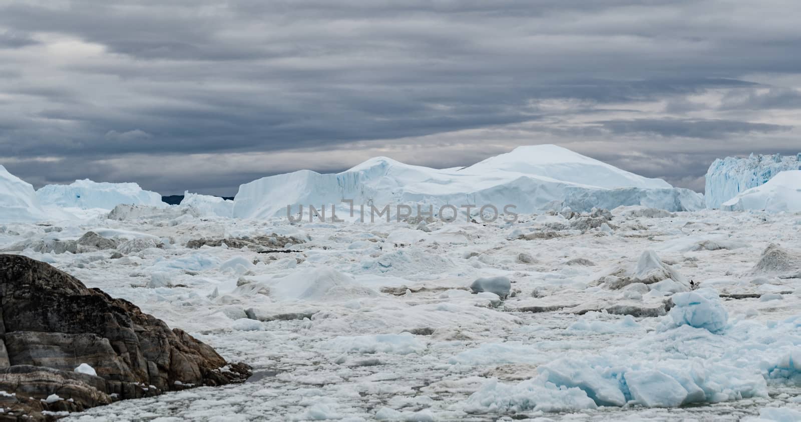 Icebergs from melting glacier in icefjord - Global Warming and Climate Change by Maridav