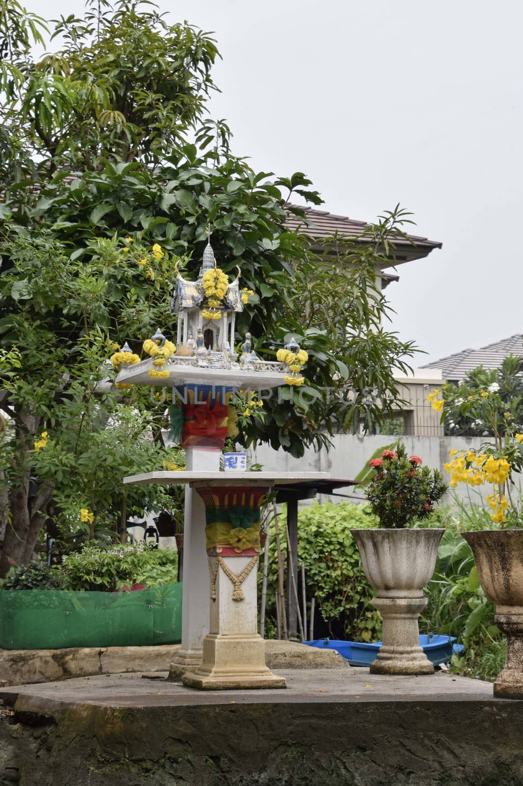 Thailand, Bangkok - March 2016: Family spirit houses in the garden of  thai families living in Bangkok