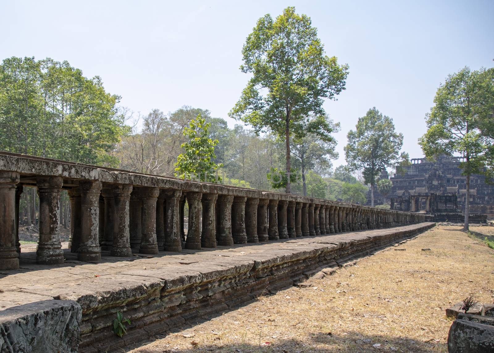 Angkor Thom, Cambodia, March 2016: A stone causeway supported by many finely carved columns provides an impressive entrance to the Baphuon temple mountain.