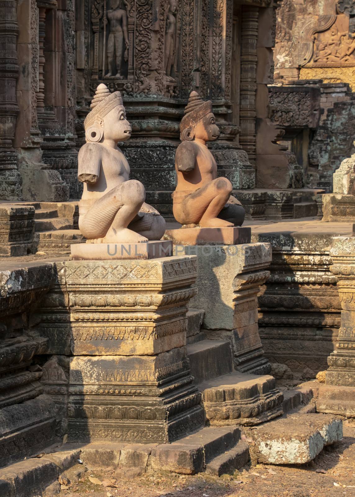 Cambodia, Banteay Seay - March 2016 - Reconstructed ruins of ornately carved 10th-century, red sand stone, temple dedicated to the Hindu god Shiva, bathed in the early morning light