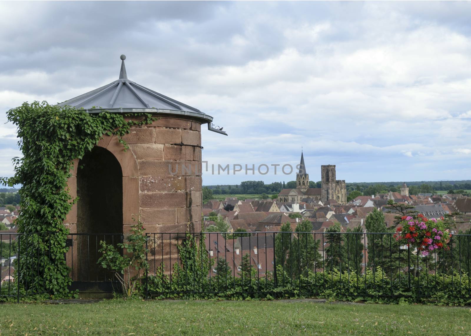 France, Alsace, June 2015: Stone tower and doorway in turret overlooking medieval village and church