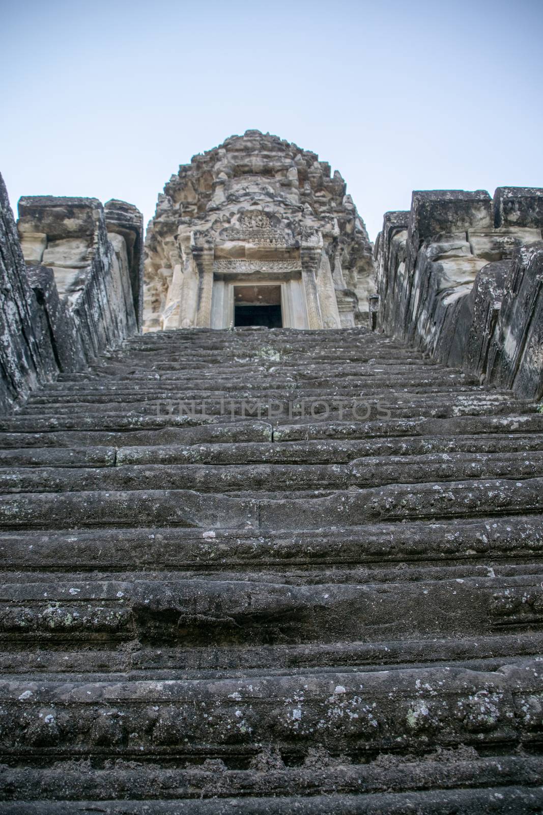 Angkor Wat, Cambodia - March 2016: Stariway up the main temple at Angkor wat. Originally constructed in the early 12th century, the ruins are a huge tourist attraction as well as a place of worship today