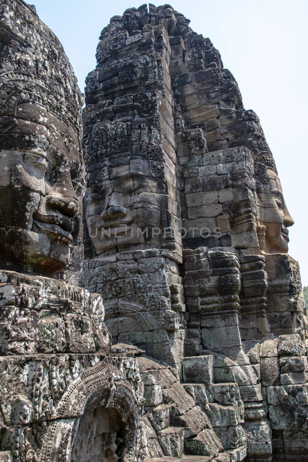Cambodia, Bayon Temple - March 2016: Bayon is remarkable for the 216 serene and smiling stone faces on the many towers jutting out from the high terrace and cluster around the central peak