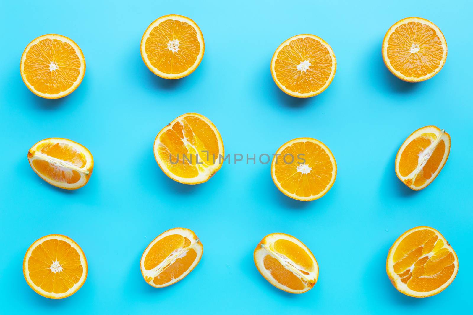 High vitamin C, Juicy and sweet. Fresh orange fruit  on blue background. Top view