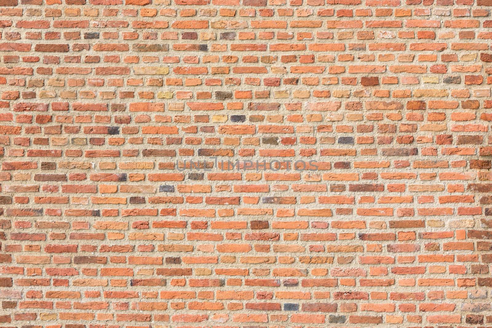 Old red brick wall as seamless texture or background
