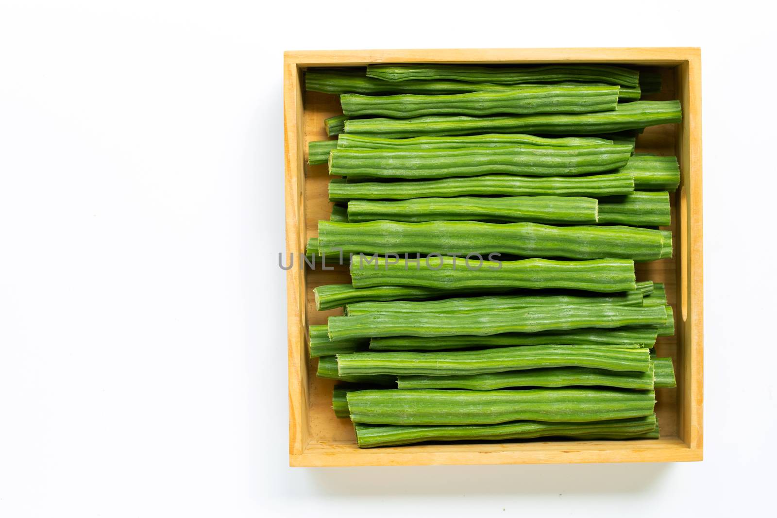 Moringa oleifera in wooden box isolated on white background.