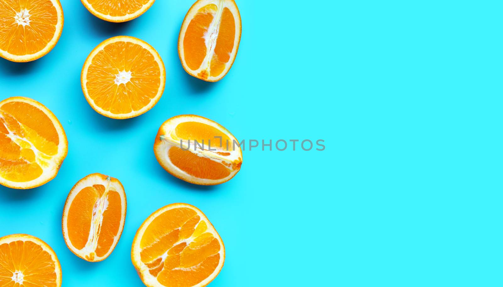 High vitamin C, Juicy and sweet. Fresh orange fruit  on blue background. Top view