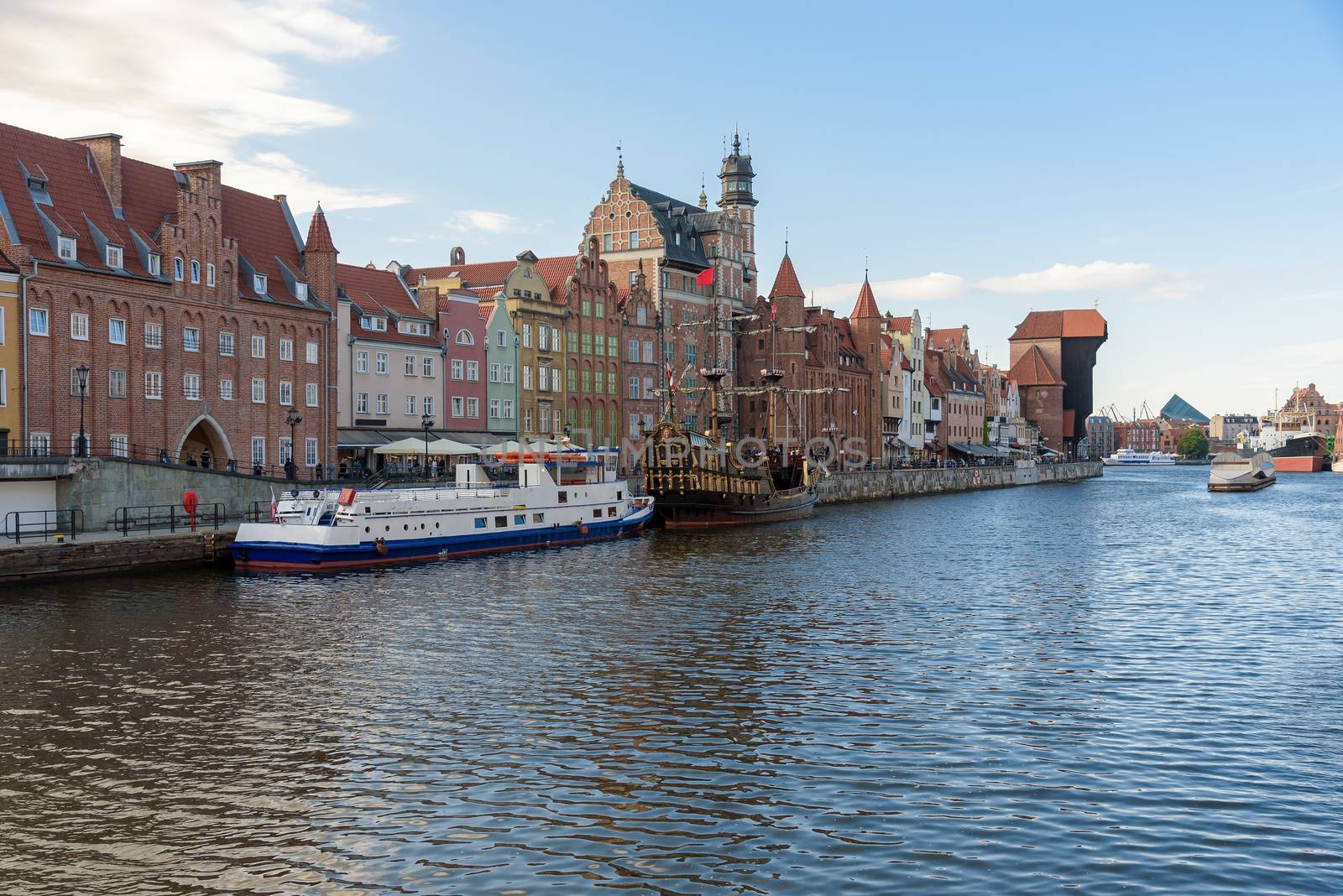 Passenger ships moored in pier at Motlawa river in Gdansk old town, Poland