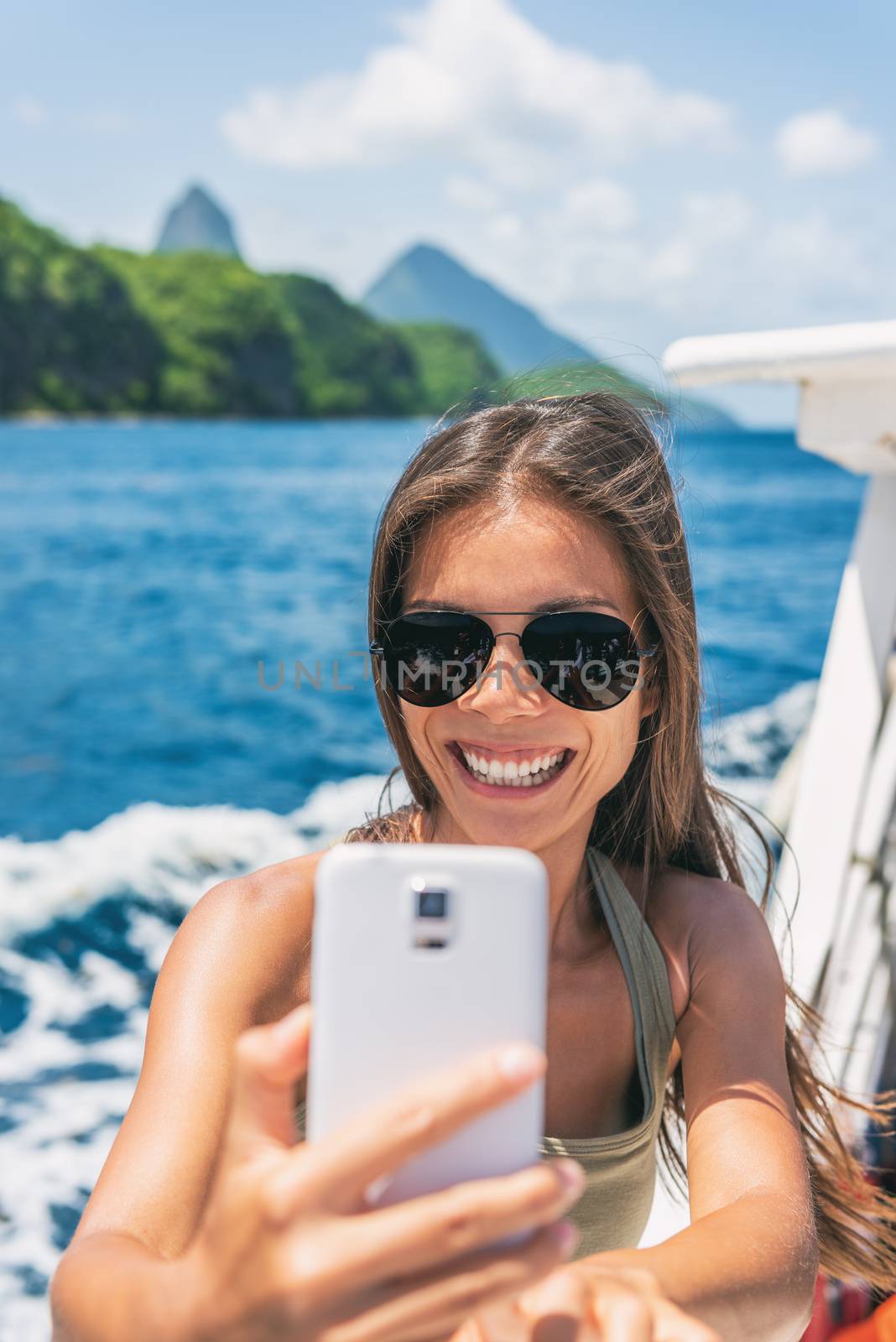 Cruise caribbean travel selfie tourist Asian girl on St Lucia Pitons mountains boat ride tour excursion. Summer sun holidays. by Maridav