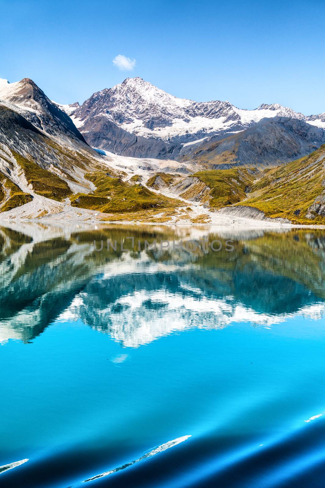 Glacier Bay National Park, Alaska, USA. Amazing glacial landscape view from cruise ship vacation travel showing mountain peaks and glaciers on clear blue sky summer day by Maridav