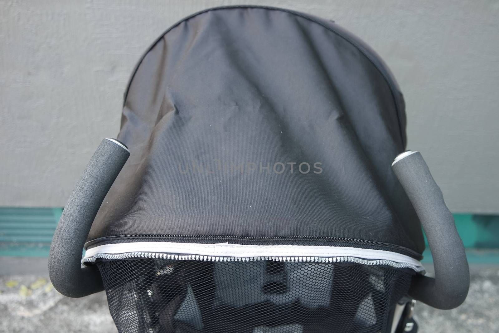 Black color baby stroller with head covering by Photochowk