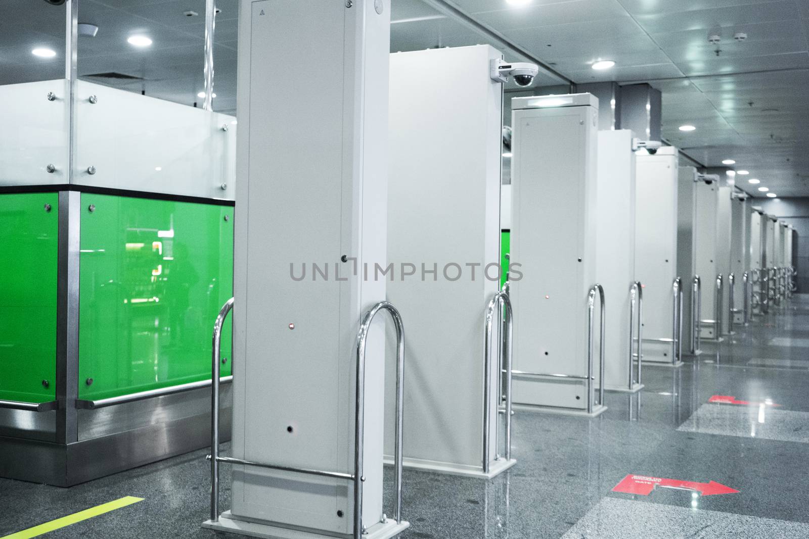 A row of columns, passport control area at the airport.