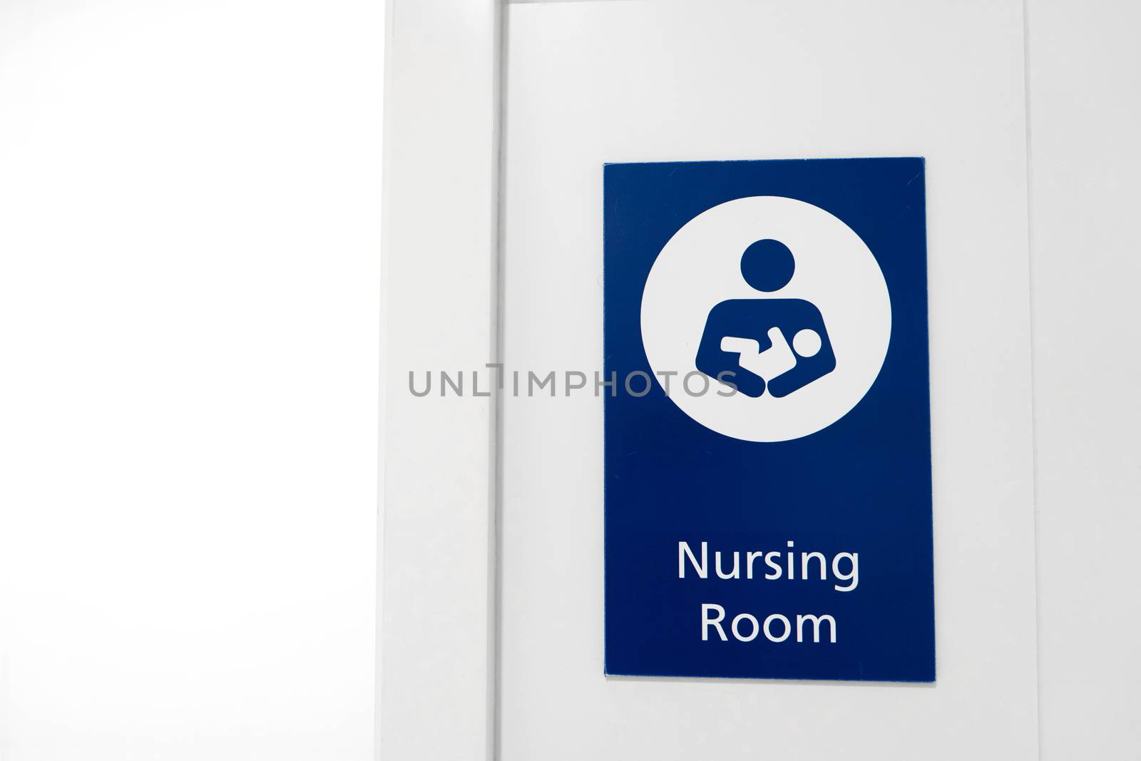 A sign at the entrance to the baby nursing room. Feeding and swaddling children in a public place