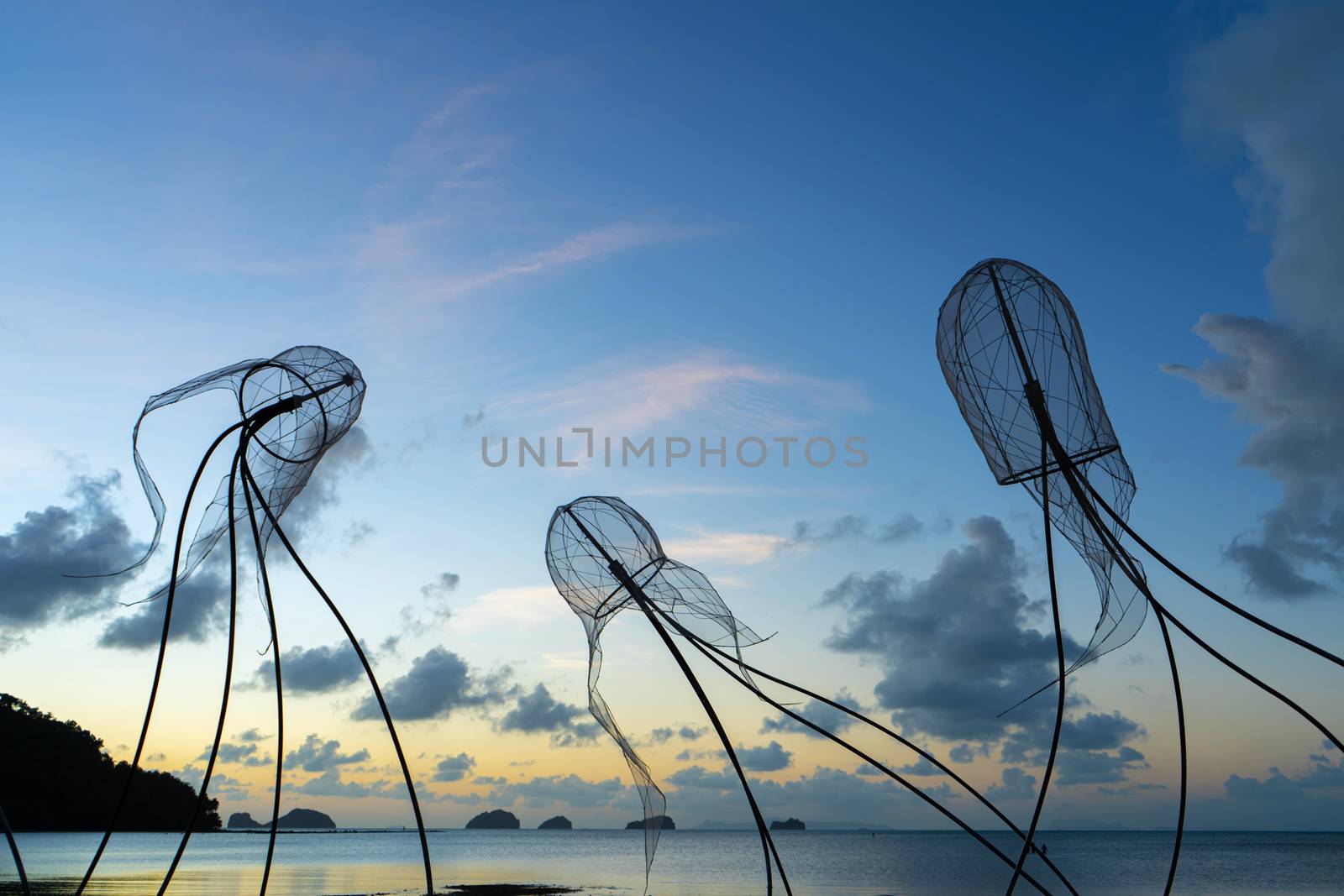 Figures of jellyfish on a background of a sunset sky. by Try_my_best