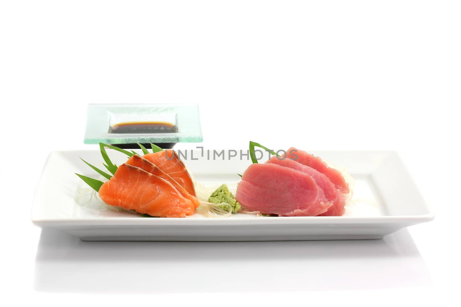 salmon and tuna sashimi isolated in white background by piyato