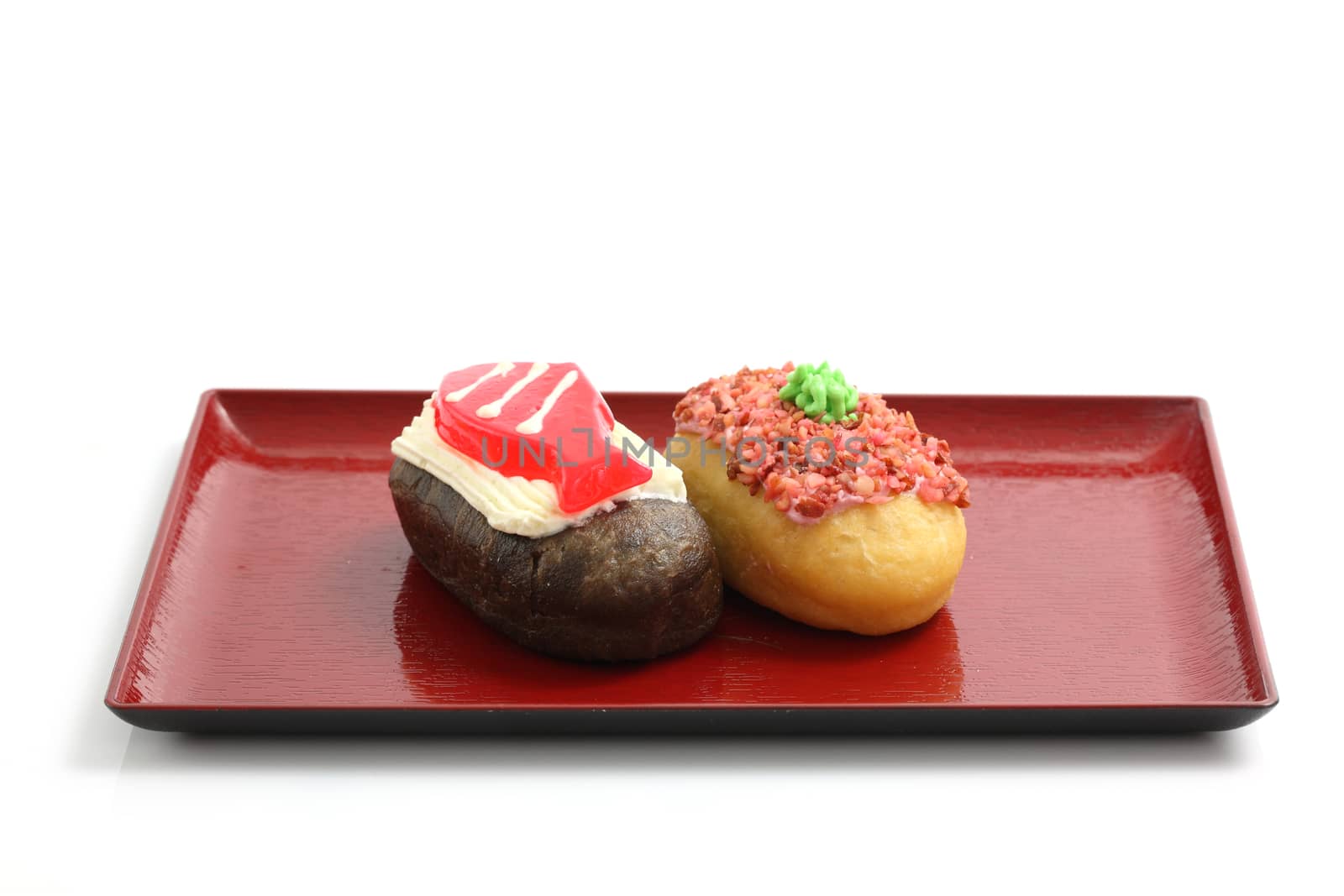 Donut sushi isolated in white background by piyato
