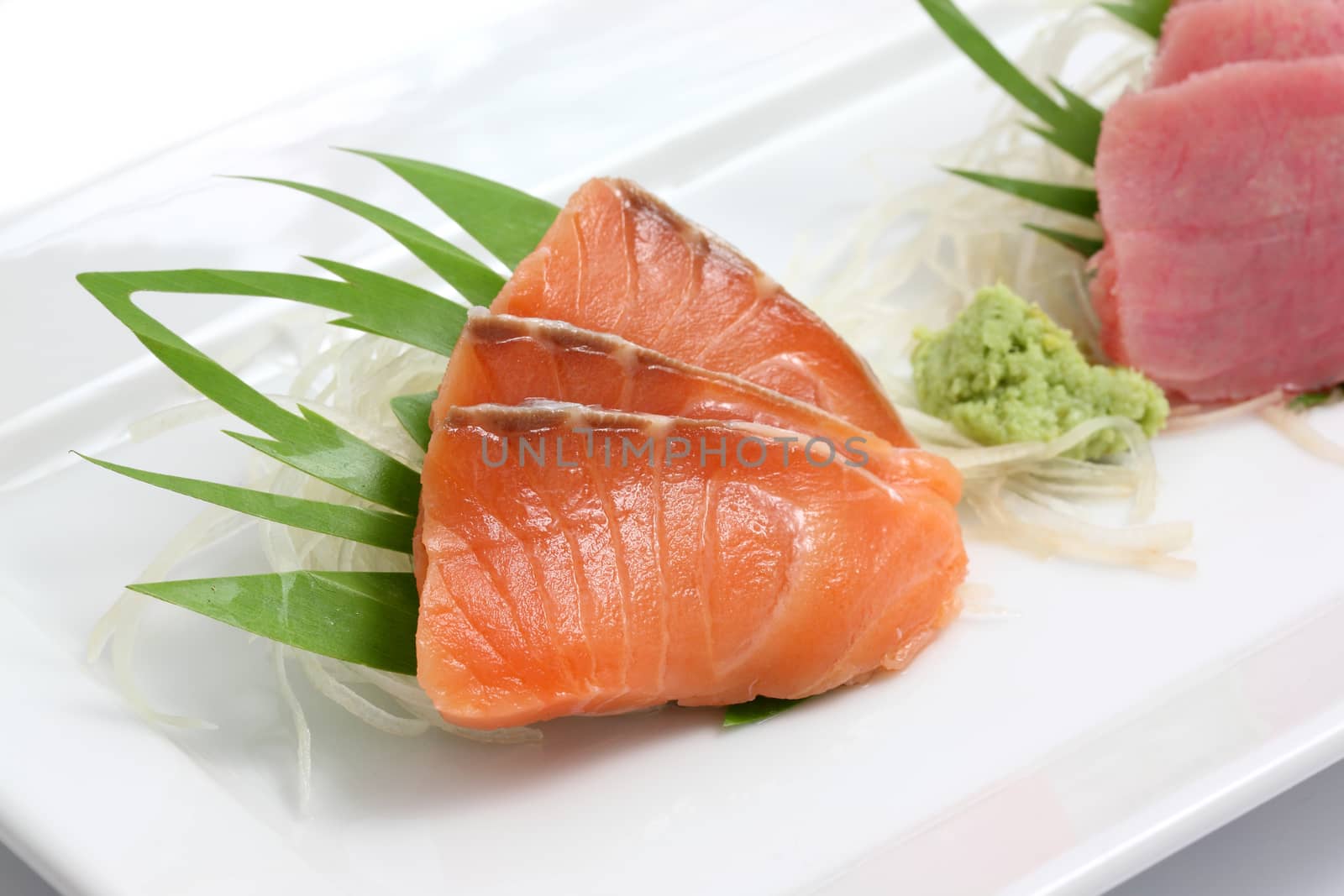 salmon sashimi isolated in white background by piyato