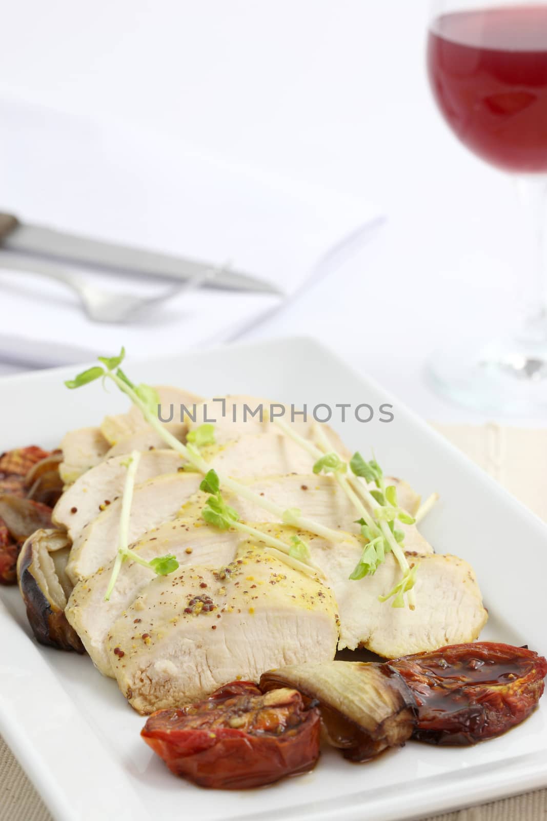 Chicken salad with wine in white background by piyato