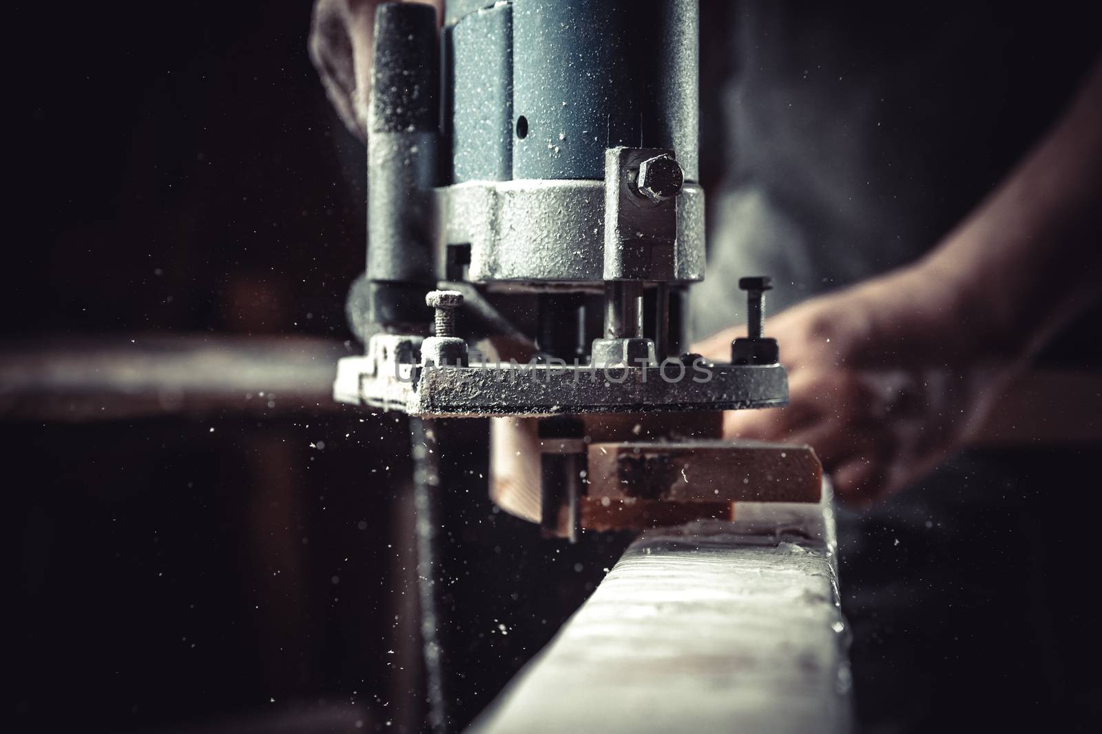 detail of electric milling cutter in joinery during wood milling.