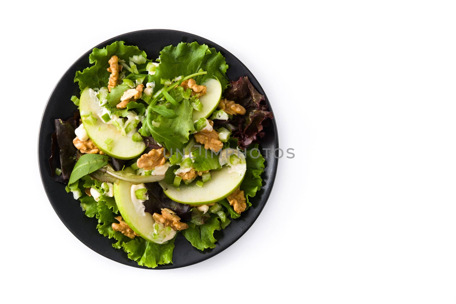 Fresh Waldorf salad with lettuce, green apples, walnuts and celery isolated on white background