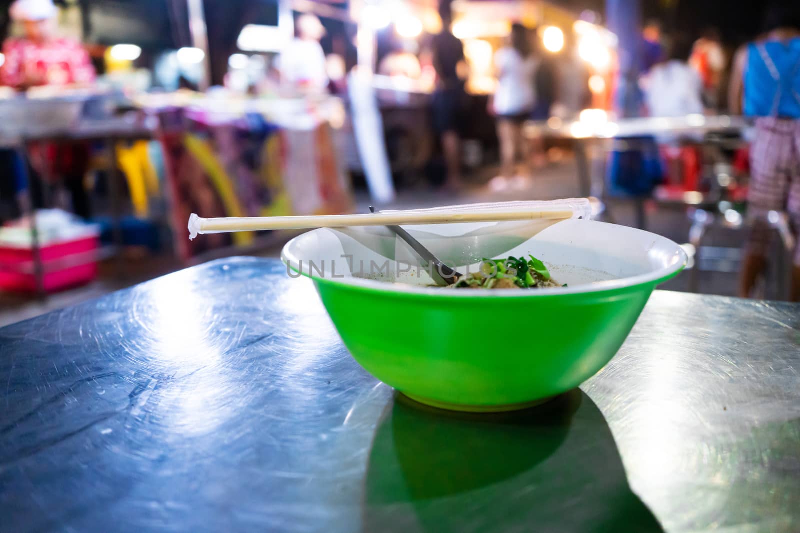 Asian food. A plate of beef soup at a street food night market by Try_my_best