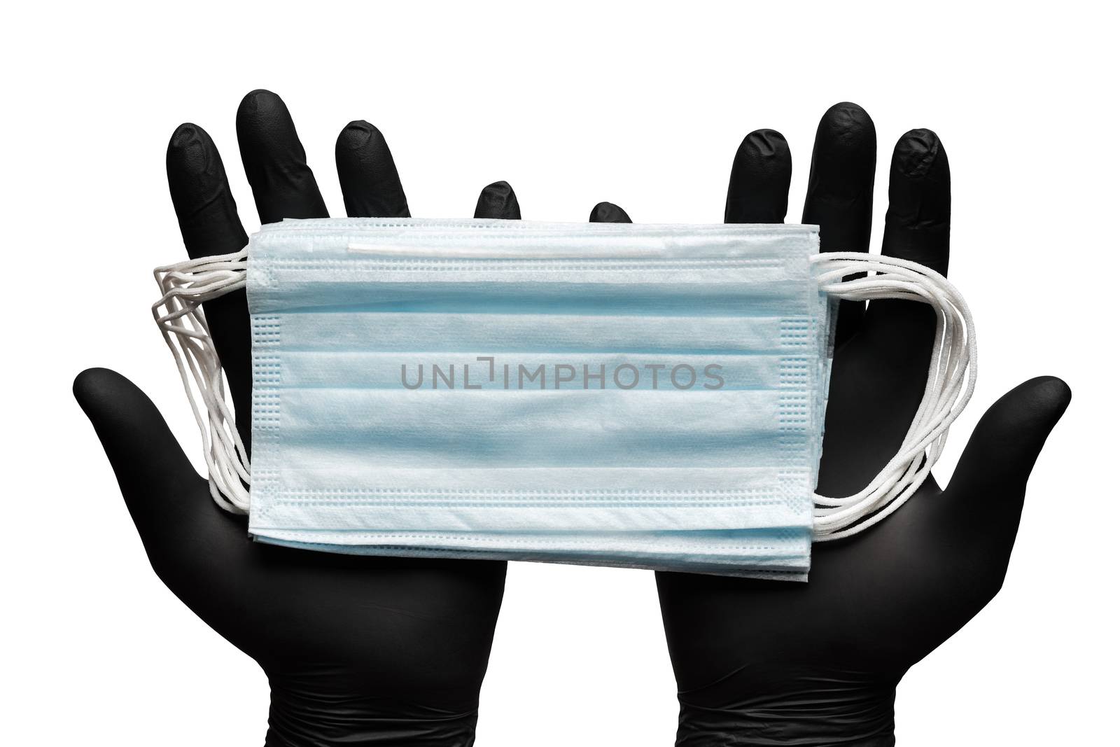 Doctor holds lot surgical face masks in two hands in black medical gloves. Isolated on white background. Concept coronavirus quarantine, pandemic outbreak. Medical respiratory bandage for human face.