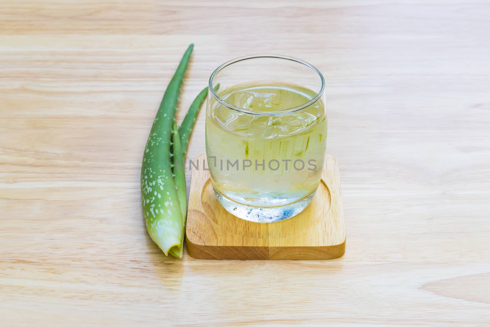 Aloe Vera for drinking on wood table 