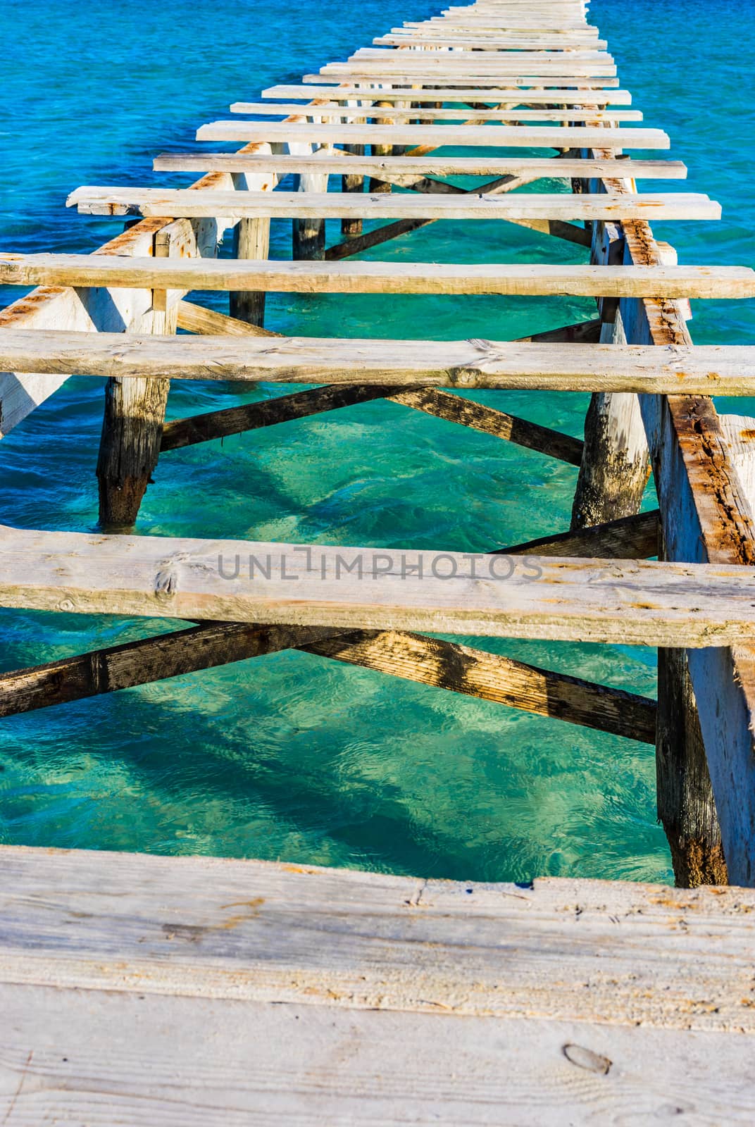 Close-up of damaged old wooden pier