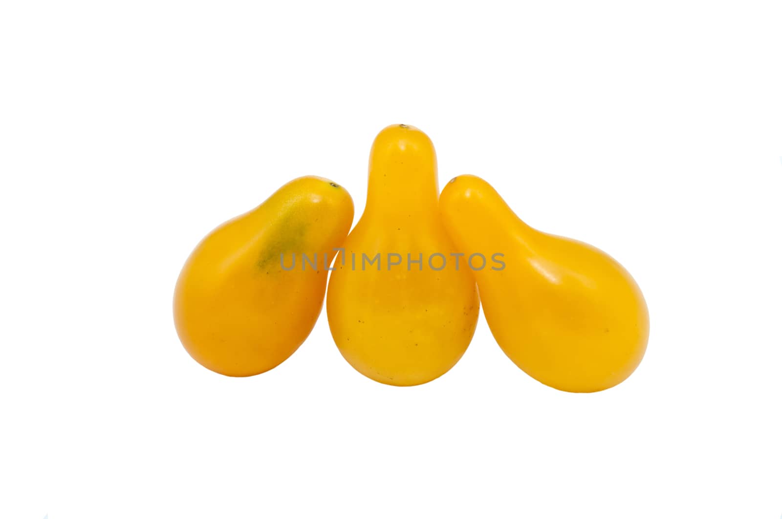 three yellow tomatoes isolated on white background