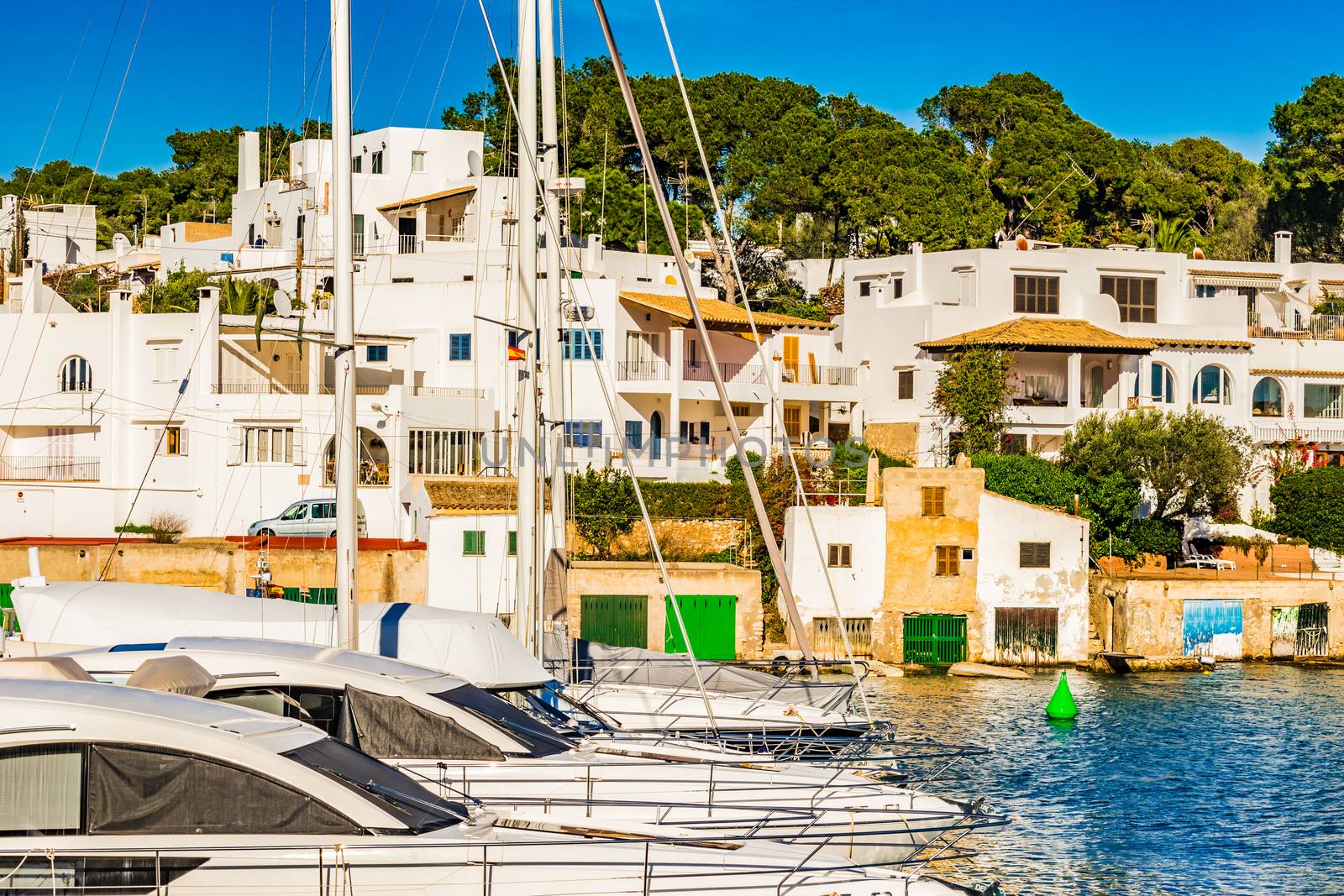 Anchored boats in mediterranean marina of Cala Dor, Majorca island, Spain