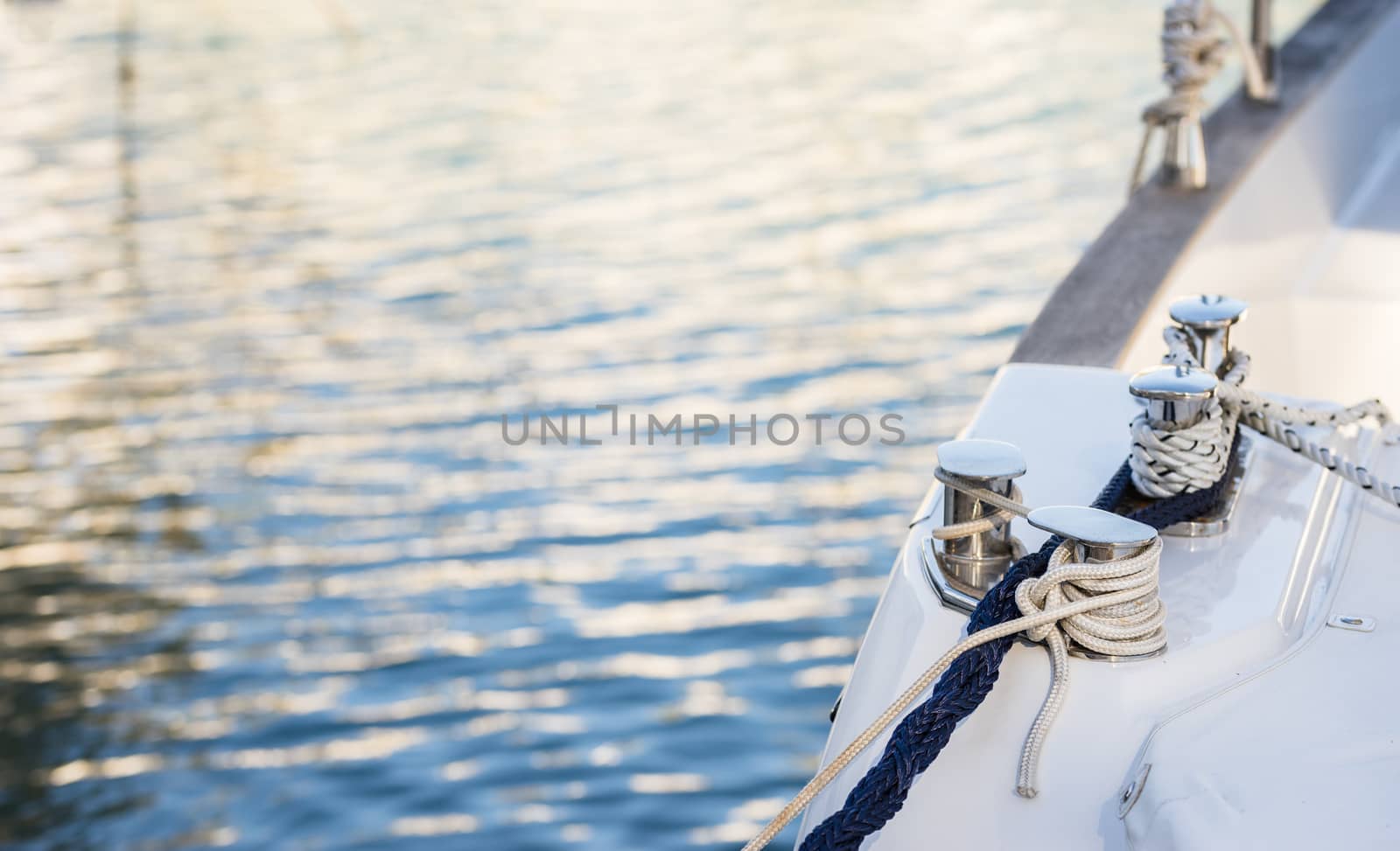 Luxury sailing yacht anchoring at marina