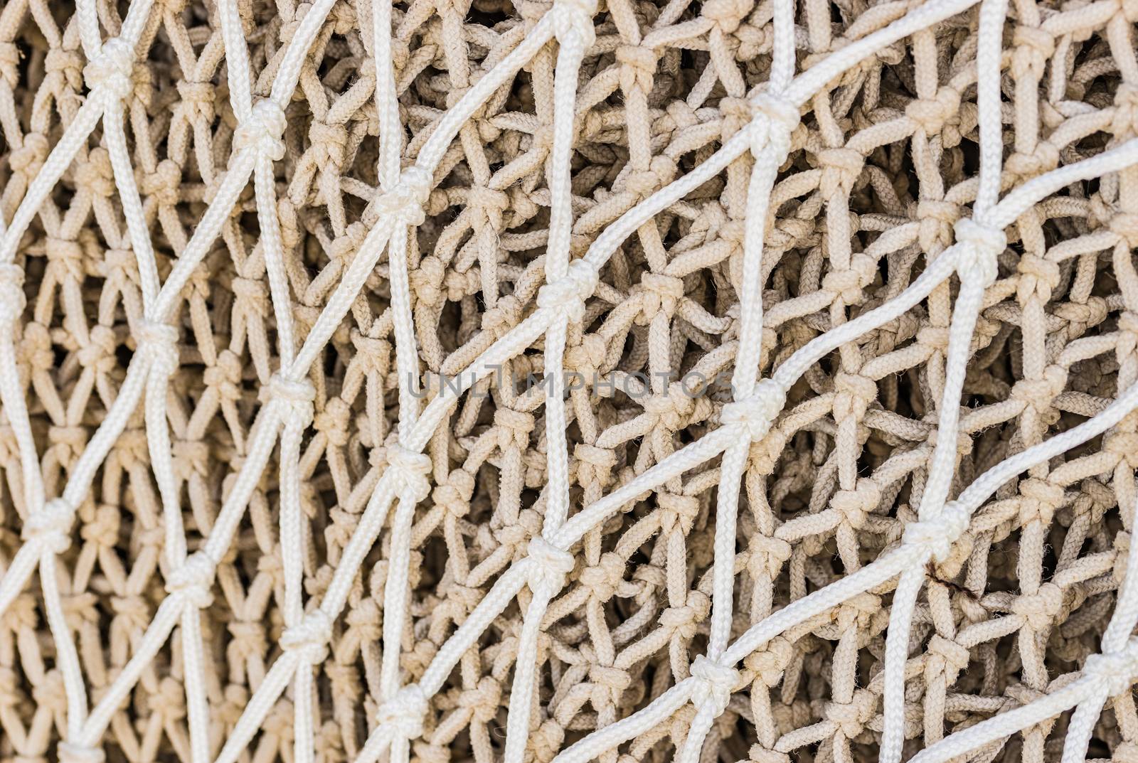 Close-up of commercial fishing net at harbor