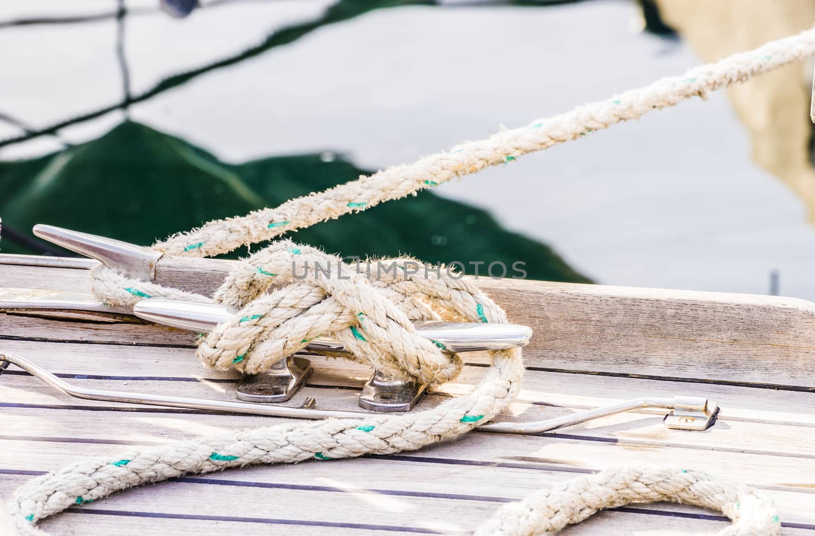 Detail view of yacht rope cleat on sailboat deck