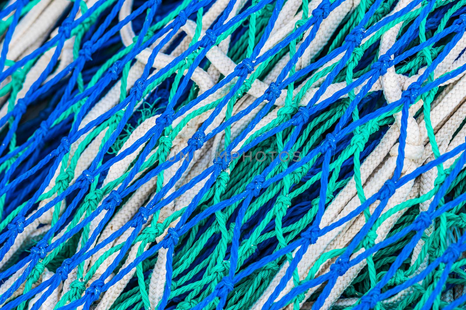 Close-up of blue fishing nets pattern background 