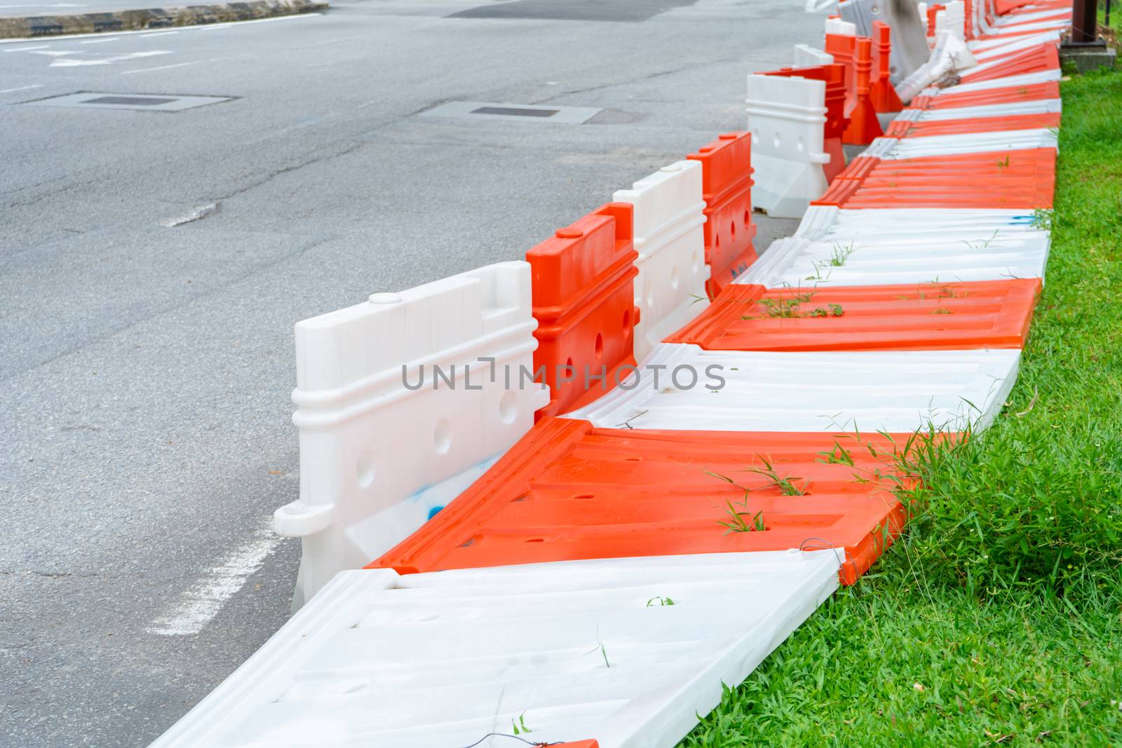 Plastic blocks restricting the passage of cars during repair work. Safe Plastic Road Fences by Try_my_best