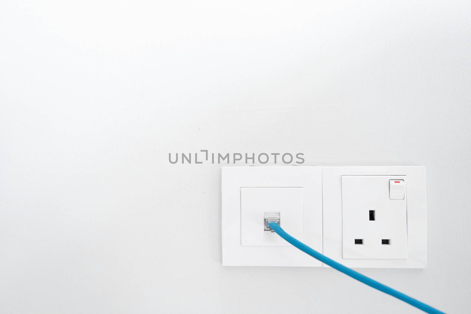 Power socket and Internet socket. Socket Malaysian type. Socket with switch on a white wall. by Try_my_best
