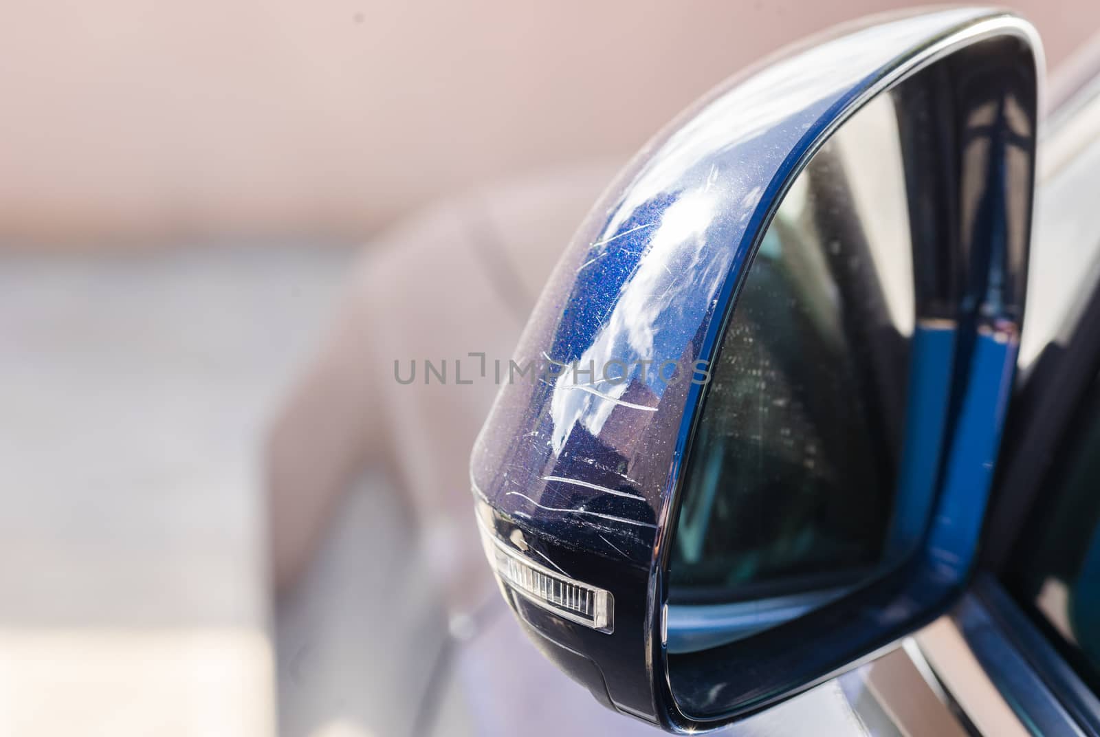 Damaged car side-view mirror after crash

